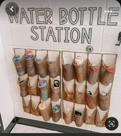 the water bottle station is filled with cups