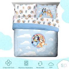 an image of a bed set with cartoon animals on the sheets and pillowcases