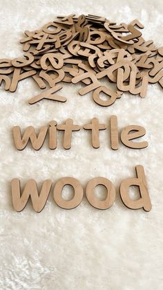 wooden letters spelling out the word swift and bow on a white furnishing area