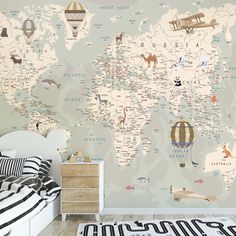 a map of the world with animals and hot air balloons on it's wall