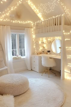 a white bedroom with lights on the ceiling