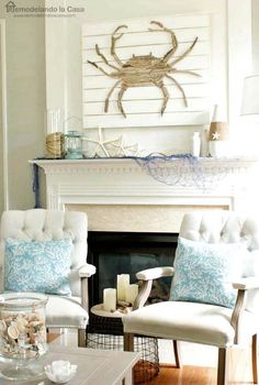 a living room filled with furniture and a fire place in front of a painting on the wall