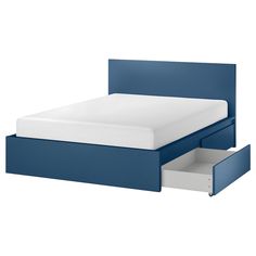 a blue bed with two drawers underneath it