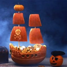 a pirate ship made out of pumpkins and other items