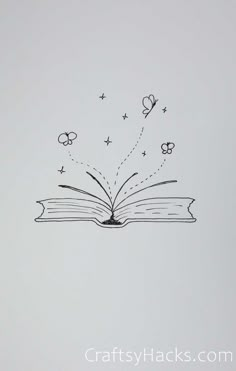 an open book with flying butterflies coming out of it and the pages are drawn in black ink