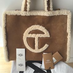 Wore Bag 2x To Do A Review. New/Newish With All Tags & Dust Bag Kept In Closet. No Blemishes, No Stains, No Marks, No Dust, No Scratches. Telfar X Ugg; This Is A Limited Edition Telfar. He Only Releases This Color 1-2x A Year. Very Hard To Get. Other Sellers Offering This Bag At Double The Price. This Is The Traditional Medium Sized Offered By Telfar. Beautiful Bag Goes Well With All Uggs Fleece Sweaters; Coats Jacket. Telfar Cream, Telfar Ugg, Telfar X Ugg, Fleece Sweaters, Telfar Bags, Branded Shopping Bags, Tan Bag, Chestnut Color, Medium Tote