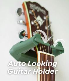 an acoustic guitar with the words auto locking guitar holder on it's back side