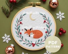 a cross stitch pattern with a fox on it and christmas ornaments around it, along with the words i'm the best stitch