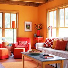 a living room filled with furniture and windows