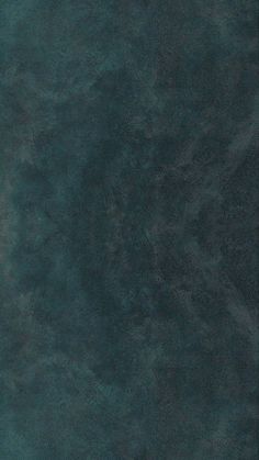 an image of a dark green textured wallpaper with no pattern or design on it