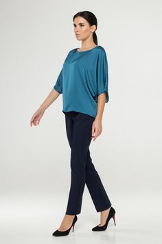 "A soft satin blouse featuring a boat neckline, half dolman sleeves, loose silhouette, and a relaxed fit. - kimono style blouse - loose silhouette - boat neck - half sleeves - Color: blue Fiber: 30% viscose, 70 % polyester. You may feel free choosing the size. Just send us your measurements (bust, waist, hips, height). We will define your correct size. SIZE CHART XS __ EU 34 __ US 4 bust: 31,5\" | 80 cm waist: 24,5\" | 62 cm hips: 34,5\" | 88 cm S __ EU 36 __ US 6 bust: 33,0\" | 84 cm waist: 26, Versatile Viscose Blouse For Evening, Silk Tops With Draped Sleeves For Work, Silk Top With Draped Sleeves For Work, Elegant Stretch Viscose Blouse, Blue Silk Blouse With Blouson Sleeves, Chic Stretch Viscose Blouse, Blue Batwing Sleeve Blouse For Summer, Chic Boat Neck Top For Work, Spring Silk Stretch Blouse