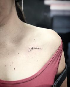 a woman with a small tattoo on her chest