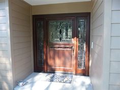 the front door of a house with glass panels