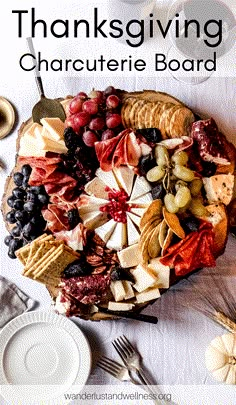 a platter filled with cheese, crackers and fruit