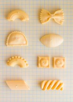 several different types of pastries are arranged on a sheet of paper with blue lines