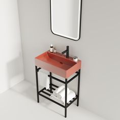 a bathroom with a sink, mirror and towel rack