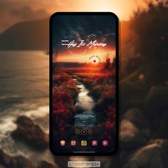 an image of a phone screen with the sun setting over water and hills in the background