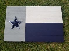 a wooden flag with a star on it