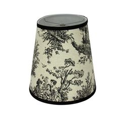 a black and white lamp shade with trees on it