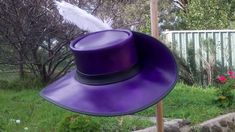 The Musketeers' Purple leather D'Artagnan Hat:  Hand made in Melbourne by John Whittaker, master leather craftsman since 1972 Made using top quality, sturdy cowhide leather  Hand dyed (different colours available) Comes with ribbon hat band, feather & silver concho ornament  Lined on the inside with elegant crushed velvet Custom variations are possible - contact us regarding any queries or ideas  This hat will last in fine shape for many years, even with lots of handling & wear We custom make ea Alexandre Dumas, Leather Craftsmen, Purple Leather, Hat Band, Crushed Velvet, 17th Century, Air Mail, Cowhide Leather, Hand Dyeing