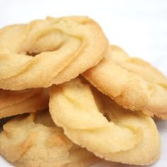 a pile of cookies sitting on top of a white countertop next to each other