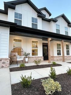 a house with white siding and black trim