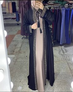 Our two-piece abaya set is made of two different layers and can be worn separately with other pieces of clothing as well. Two Piece Abaya, Abaya Gown, Simple Crossbody Bag, Abaya Fashion Dubai, Dubai Luxury, Pieces Of Clothing, Abaya Designs, Business Tops, Abaya Fashion