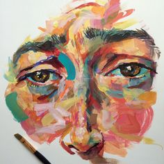 a painting of a woman's face with colorful paint strokes on it and a pencil in the foreground