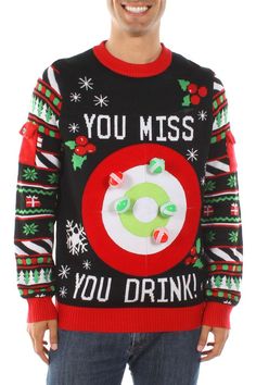 a man wearing a christmas sweater with the words you miss you drink written on it