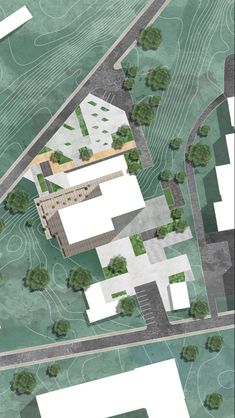 an aerial view of a building surrounded by trees and grass, with the ground plan drawn out