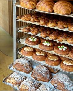 there are many different types of pastries on the shelves