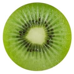 the kiwi is cut in half and ready to be eaten with its green leaves