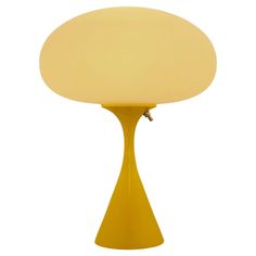 a yellow table lamp on a white background