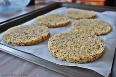 four cookies on a baking sheet ready to go into the oven in the oven pan