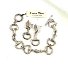 Susan Shaw New With Tag Equestrian Jewelry Set. Silver Tone Horse Bridle Bit Bracelet & Earrings Set New With Tag. Perfect For All Of My Equestrian Loving Friends. These Were Purchased At The Devon Horse Show Years Ago And I Never Wore Them. So I’m Letting Them Go To A New Home. They Both Are New But Have A Slightly Aged Patina From Hanging Around. If You Wanted To Buy These From Susan They Would Cost $135 For The Two Pieces. I Am Selling Them As A Set For $100. Horse Jewelry Handmade, Equestrian Jewelry Ashley's Equestrian Jewelry, Equine Jewelry Bracelets, Horse Jewelry Ashley's Equestrian Jewelry, Horse Jewelry Earrings, Elegant Adjustable Jewelry For Shows, Elegant Sterling Silver Jewelry For Shows, Equine Jewelry, Chunky Silver Jewellery