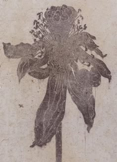 a drawing of a flower on the side of a wall