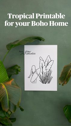 a piece of paper with a drawing of two birds on it next to some plants