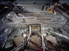 the inside of an airplane cockpit with multiple controls and other equipment on it's sides