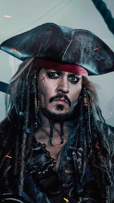 a man with dreadlocks and a pirate hat