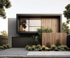 a modern house with wood siding and glass windows