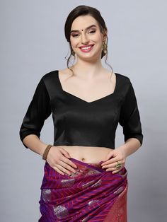 Our Satin Comfort Stretch collection blouses are made to impress and made to be worn all day. Made from the finest satin-cotton blend stretchable fabric, it holds its shape and shine while offering the comfort of stretchable material. Wear it with your favorite saree, as a crop top or lehenga choli! Item Type: Saree blouse / Crop top Product Features: Color: Black Fabric: Satin Stretch Trim: Back Dori Neck Style: Front- Sweetheart & Back- Pentagon Sleeve Length: Elbow Sleeve Closure: Back Hook P Fitted Silk Blouse In Solid Color, Fitted Long Sleeve Satin Blouse, Fitted Silk Blouse With Padding, Stretch Silk Long Sleeve Tops, Fitted Satin Tops In Solid Color, Fitted Solid Satin Tops, Fitted Solid Color Satin Tops, Black Stretch Satin Tops, Black Satin V-neck Blouse