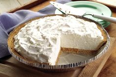 a pie sitting on top of a wooden cutting board