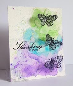 a card with three butterflies on it and the words thinking is over written in black ink