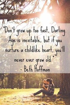 a man and woman sitting under a tree with the words don't grow up to fast