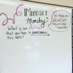 a white board with writing on it in front of a wall that says mindset monday