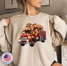 Firefighter Truck Christmas Tree Sweatshirt,Fireman Xmas Shirt,Christmas Tree Hoodie,Firefighter Wife Tee,firefighter gift,F1611 Welcome to CustomTeeChicca Store. "We want to know, design and print what you imagine. " - We design, print and press our products. - Our design will be made with Direct to Film technology. - If you want to add or change anything to the existing design that we show in the screenshot, please contact us. - If you enter the wrong address with your order, we will try to help you only if the item was not made and processed up to the packaging level to ship the item, message us from the message box. HOW TO ORDER CUSTOM DESIGN * Select a style "T-shirt, Sweatshirt, Hooded Sweatshirt or Toddler" * Choose your size. * Choose your primary color. * If your item has any cust Christmas Tree Hoodie, Truck Christmas Tree, Firefighter Wife, Firefighter Gifts, Blank Apparel, Xmas Shirts, Message Box, Style T Shirt, Firefighter