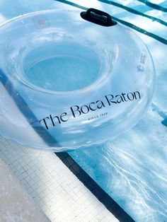 an inflatable float floating on the side of a swimming pool