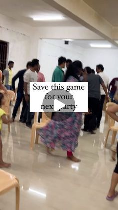 a group of people standing around each other in a room with a sign that says save this game for your next party