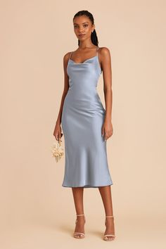 A fresh take on the 90's classic, our Lisa Matte Satin Midi in dusty blue is spun from a super luxe, matte poly satin and features skinny adjustable straps and light cowling in a bias-cut midi silhouette. A slinky midi-length bridesmaid dress with light cowl neckline and matte shine. | Dusty Blue Bridesmaid Dress Matte Satin Size 1X | Birdy Grey Lisa Midi Light Blue Cocktail Dress, Satin Dress Outfit, Grey Blue Dress, Bridesmaid Dresses Satin, Blue Satin Dress, Wedding Bridesmaids Dresses Blue, Dusty Blue Bridesmaid Dresses, Blue Silk Dress, Birdy Grey