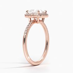 Princess Cut Cambria Halo Diamond Engagement Ring - 14K Rose Gold. This glittering halo ring features delicate pavé diamonds that encircle the center gem and adorn the band. An open gallery makes this ring light and feminine for a truly special look (1/5 total carat weight). Princess Cut Diamond Ring Gold, Luxury Cushion Cut Cluster Ring With Halo Setting, Luxury 14k Rose Gold Halo Setting Rings, Luxury 14k Rose Gold Rings With Halo Setting, Timeless 14k Gold Halo Ring, Elegant 14k Gold Halo Ring For Proposal, Luxury 14k Rose Gold Jewelry With Halo Setting, Timeless Halo Ring For Proposal, Fine Jewelry Ring With Halo And Radiant Cut